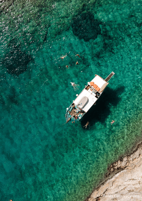 Porto Rafti: Athens Cruise Tour with Mediterranean BBQ - Four East Attica swim stops: fjord turquoise, a cave swim, and a church island
